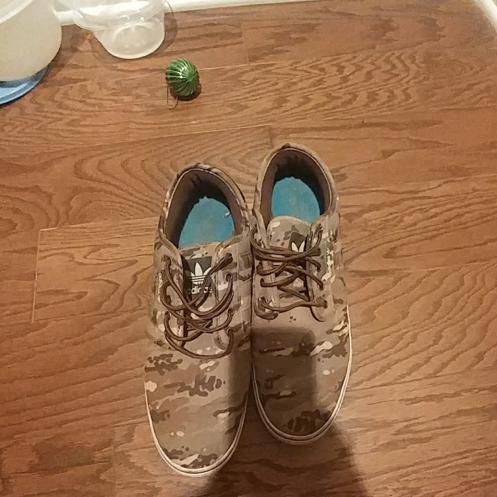 Worn cameo adidas skate shoes